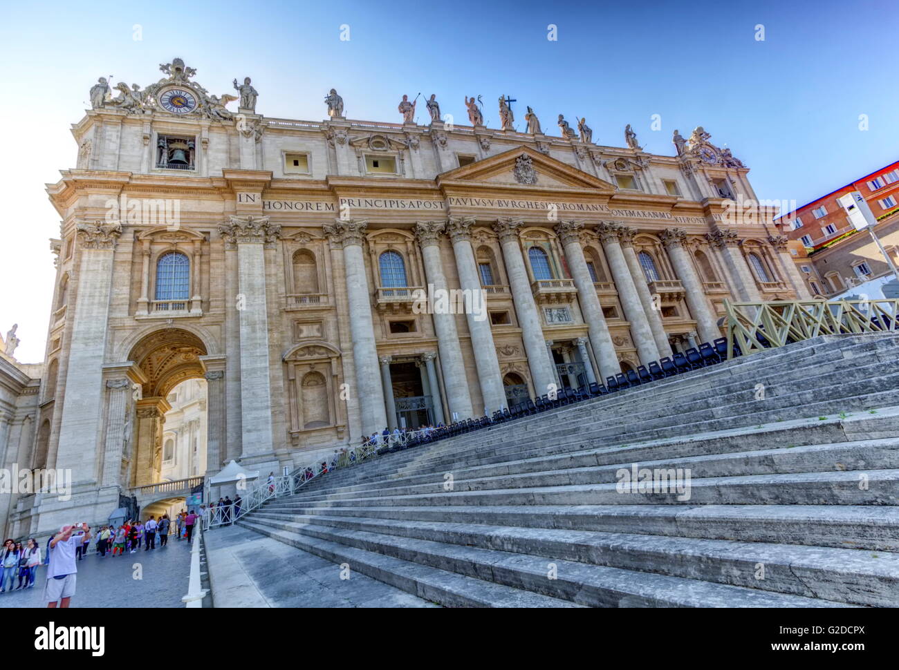Saint-Peter's basilica facade and stairs by day, Roma, Italy Stock Photo