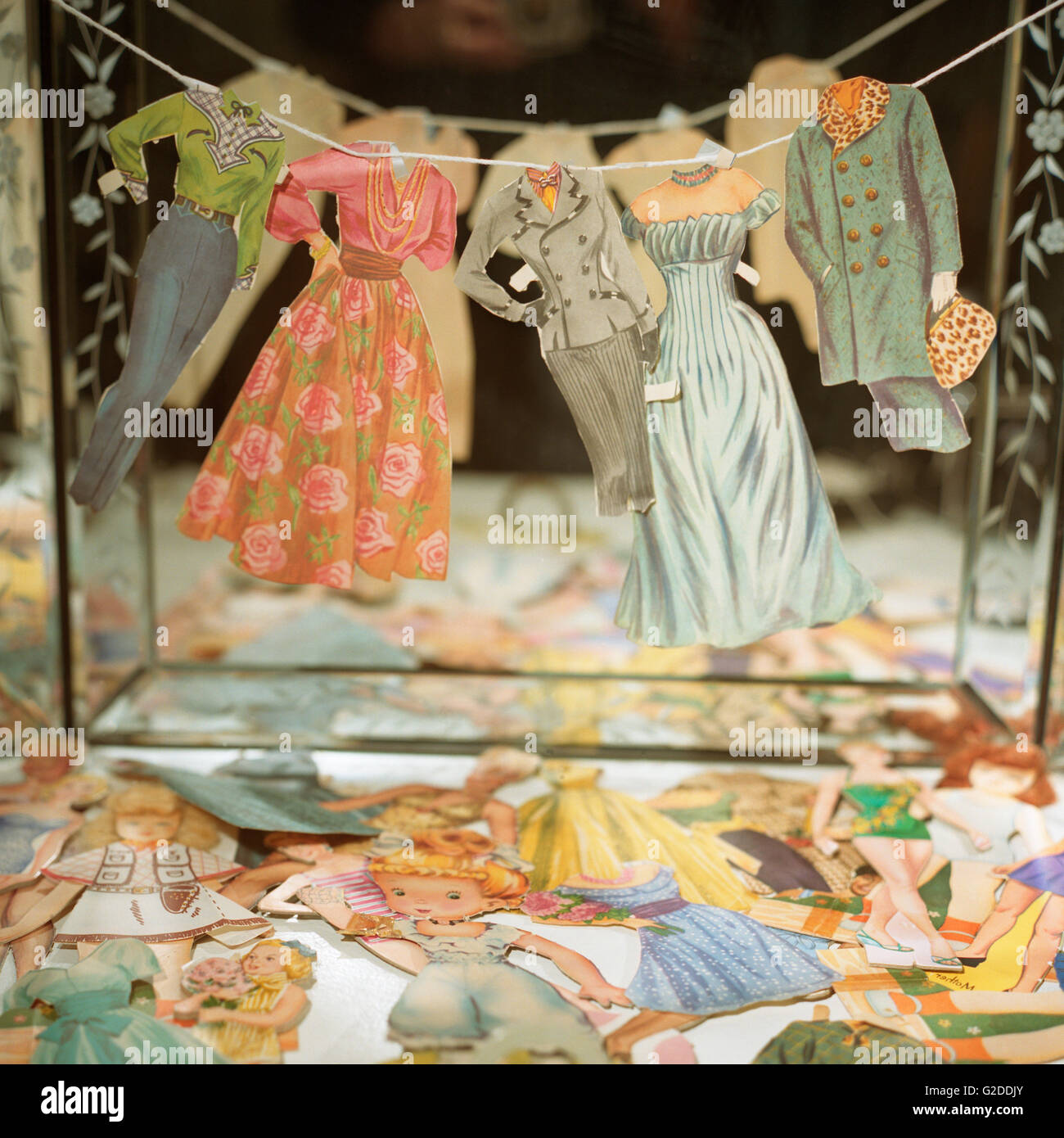 Paper Doll Clothes on Line in Front of Mirror Stock Photo - Alamy