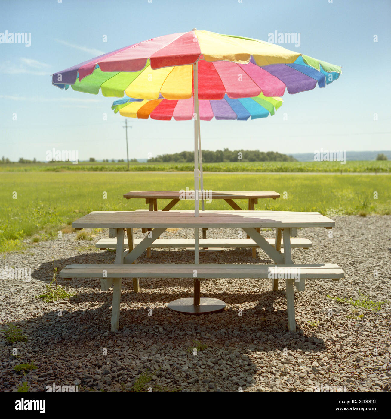 Picnic Tables With Colorful Umbrellas Stock Photo - Alamy