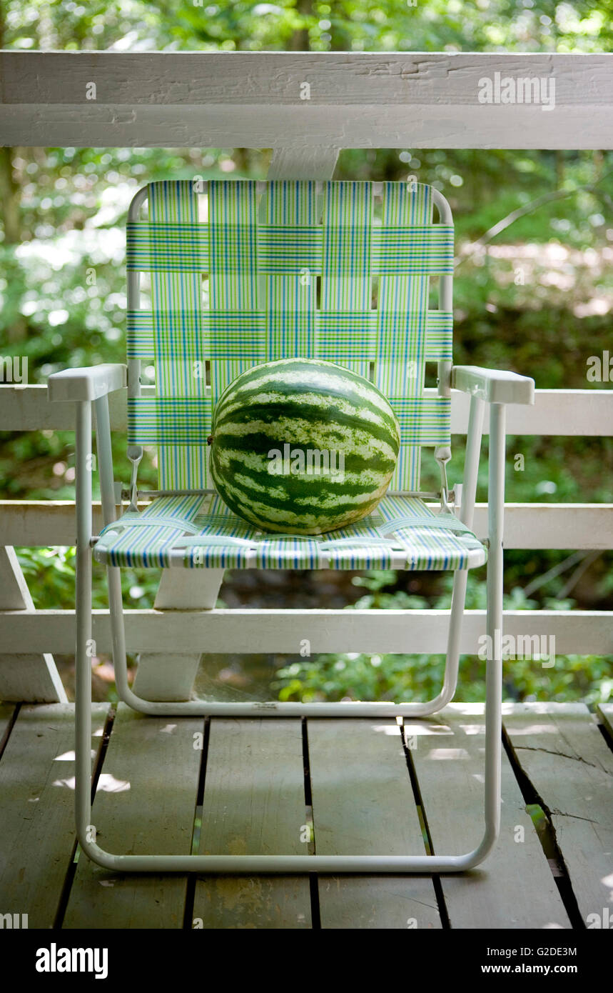 Watermelon on Lawn Chair on Porch Stock Photo - Alamy