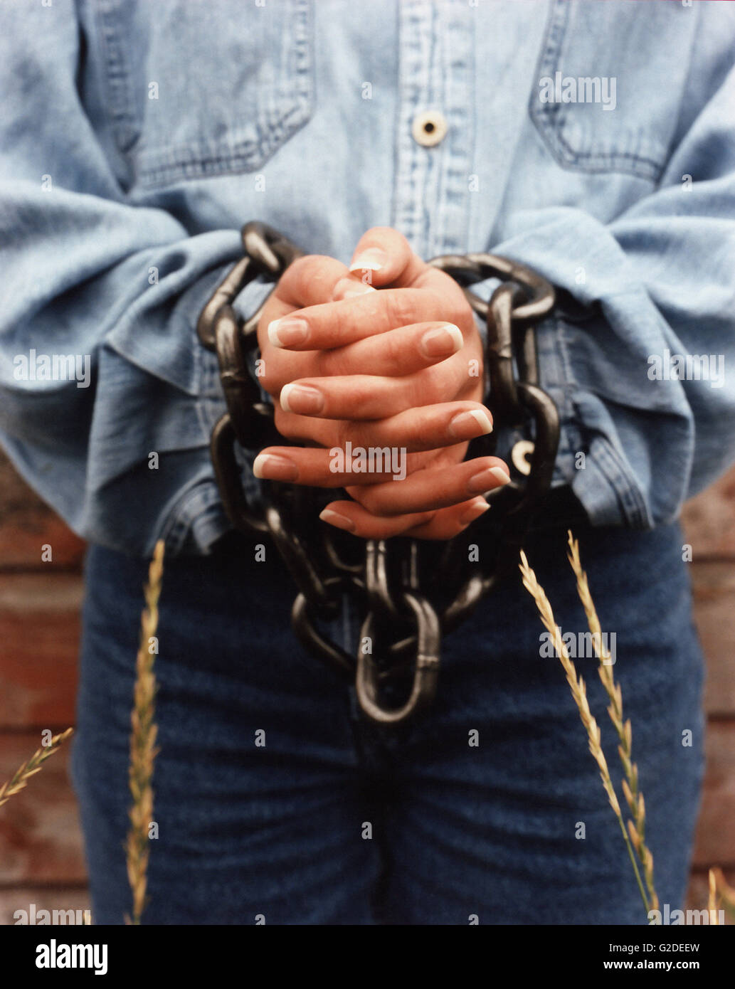 Attractive Young Woman Shackled In Chains Stock Photo, Picture and Royalty  Free Image. Image 5202772.