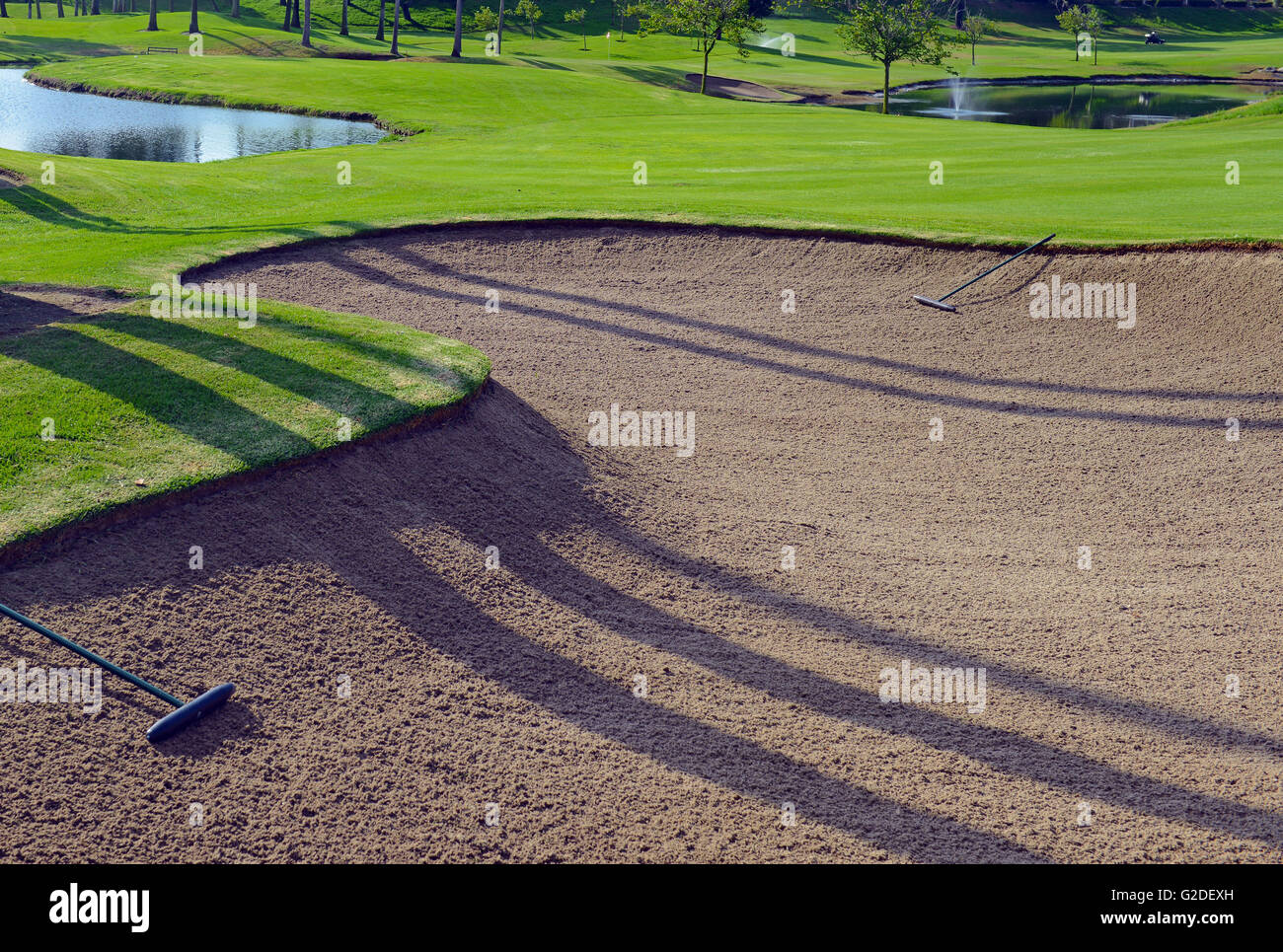 Sand trap on fairway of golf course Stock Photo Alamy