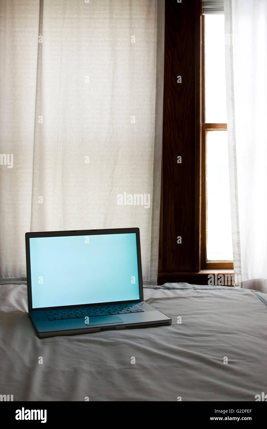 Laptop Computer on Bed by Window Stock Photo Alamy