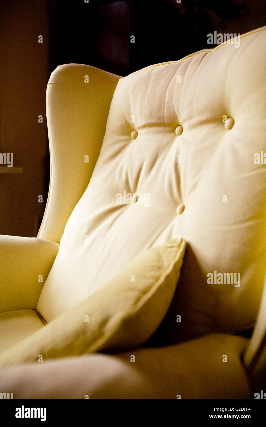 Yellow Arm Chair Detail Stock Photo - Alamy