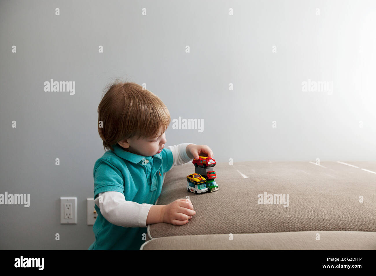 Little Boy Playing with Toy Cars Stock Photo - Alamy
