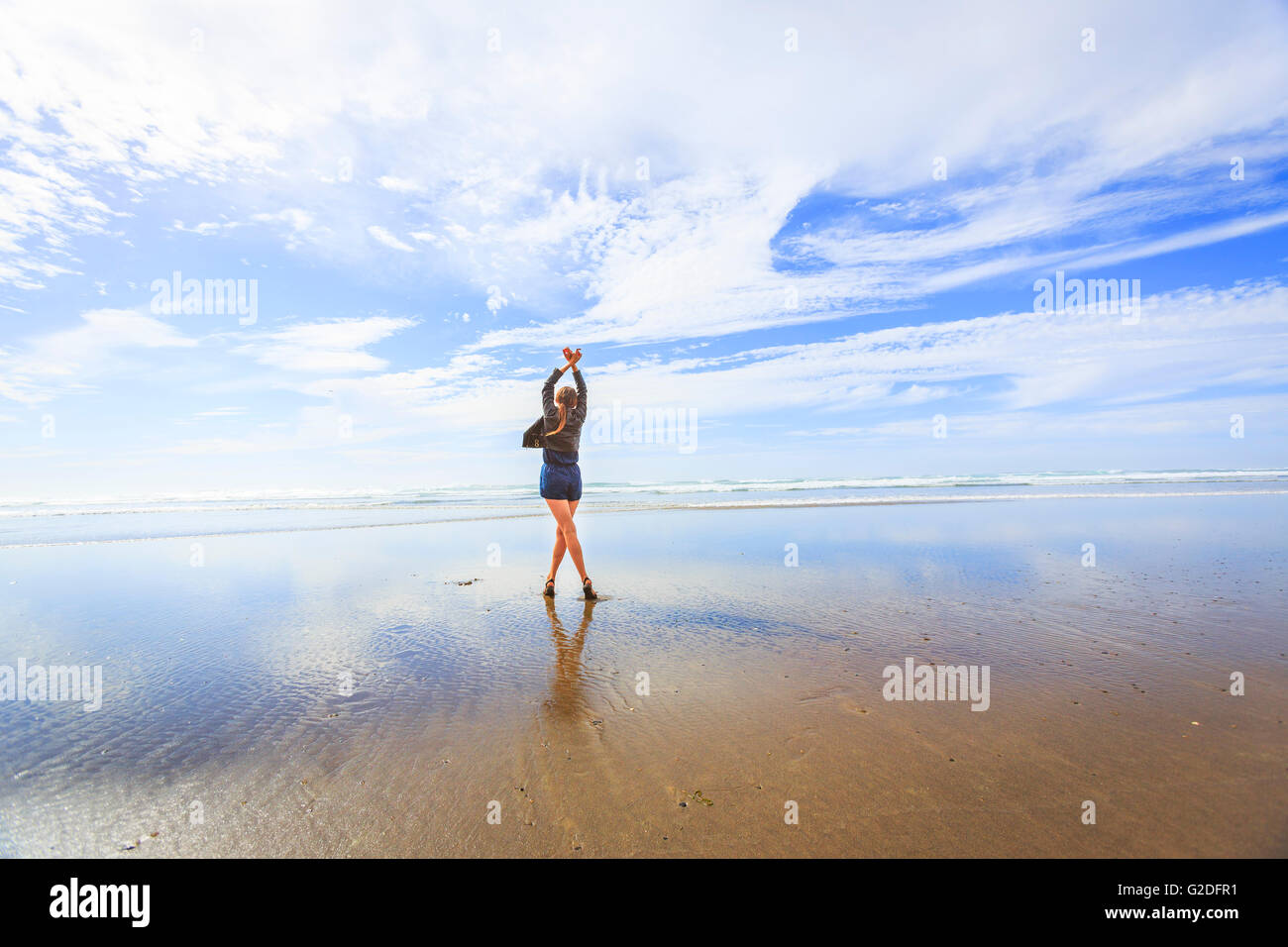 Woman dancing beach shorts hi-res stock photography and images - Alamy