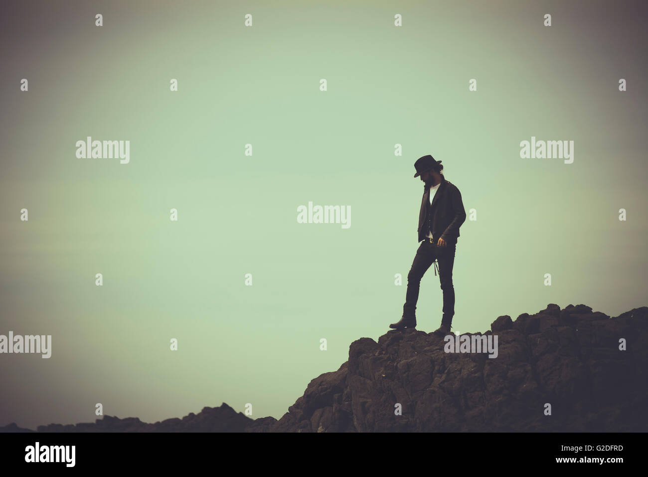 Man standing on the rocks hi-res stock photography and images - Alamy