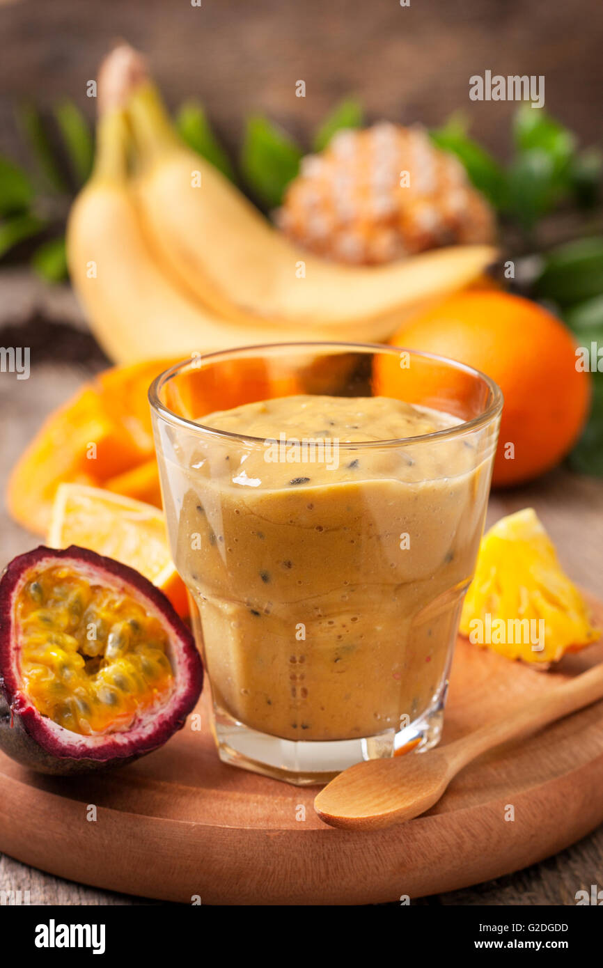 smoothie with tropical fruits mango, passionfruit, banana, pineapple