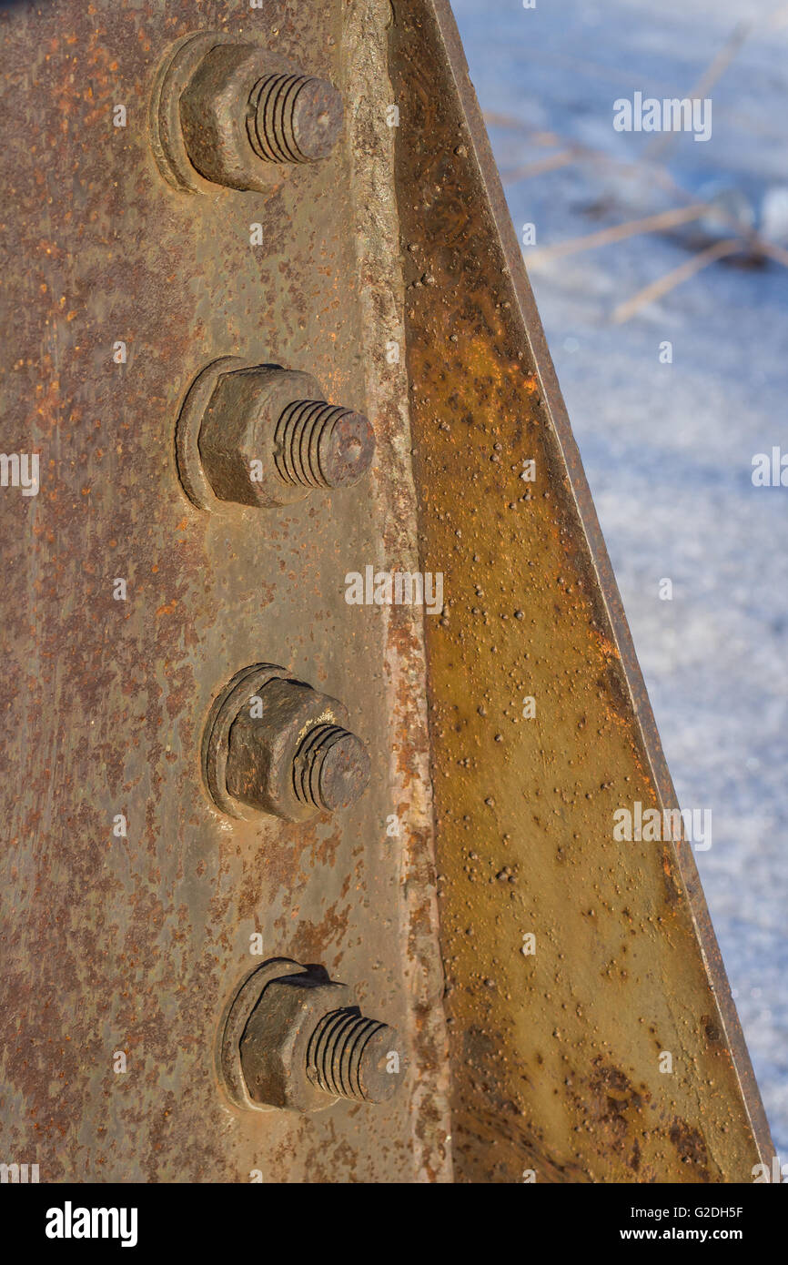 Corrosive rusted bolt with nut. industrial construction close up. Stock Photo