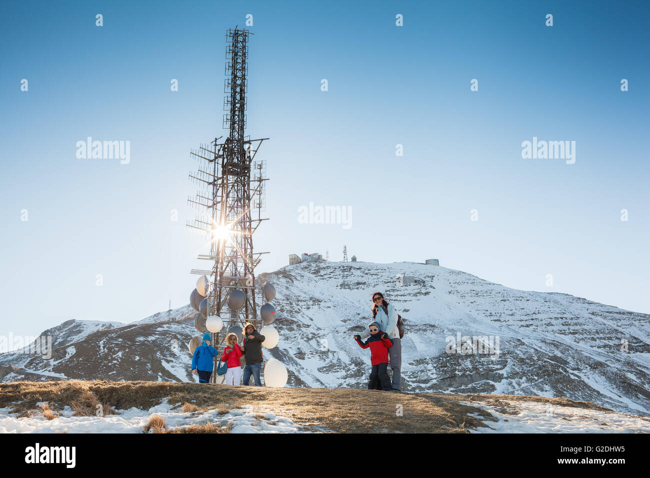 People around radio radar tower in Cimone mountain in Italy Stock Photo