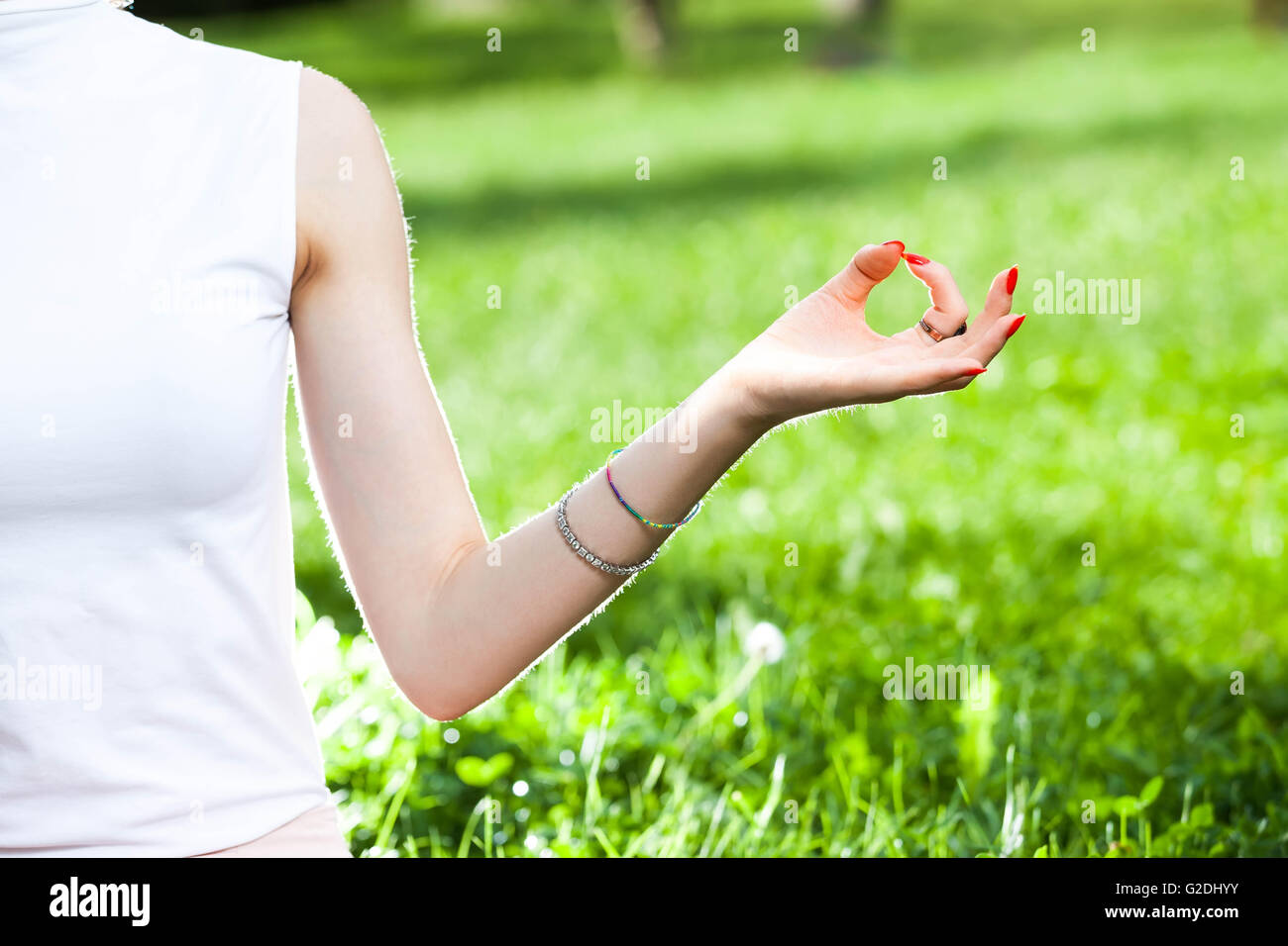 young Caucasian woman hand in Gyan mudra yoga position symbolizes mental peace Stock Photo