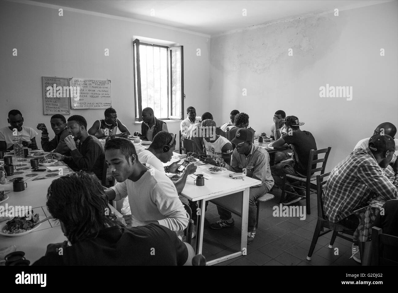 Italy, Sant'Angelo Lomellina, refugee center, lunch time Stock Photo