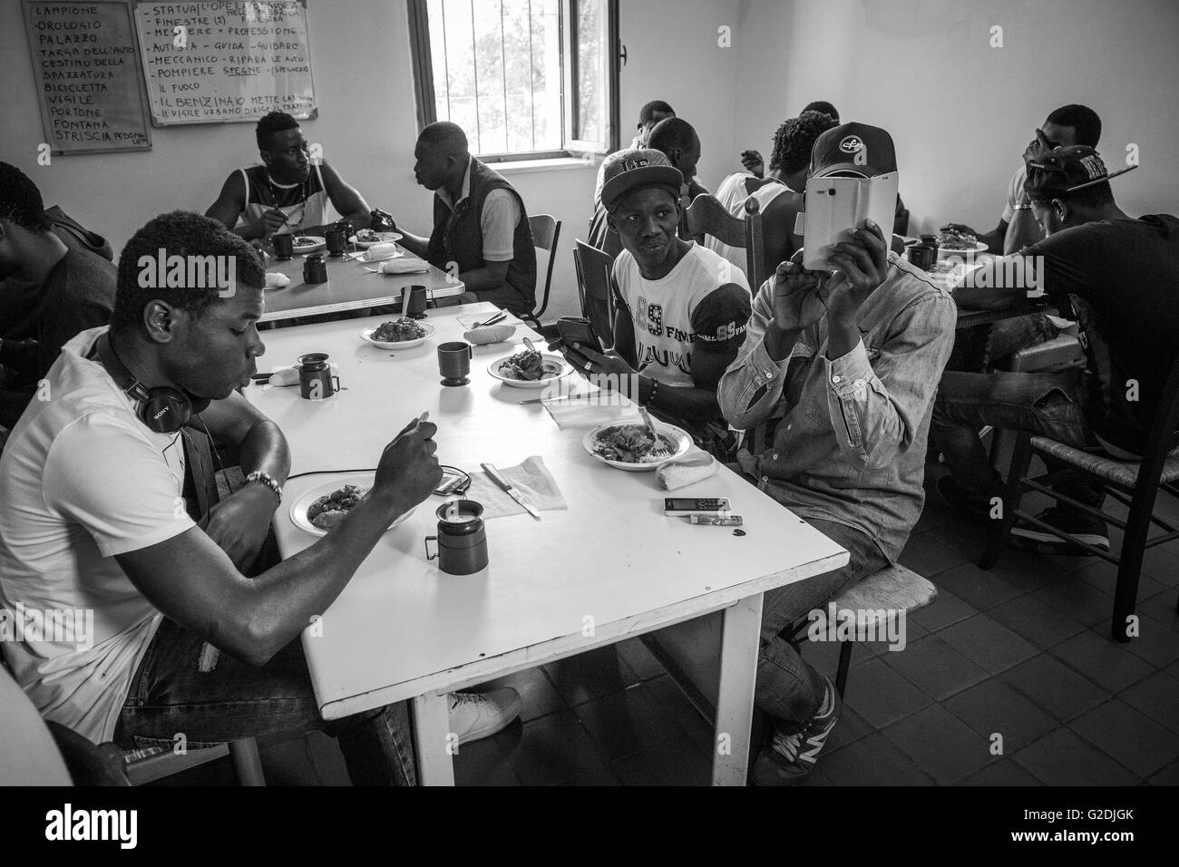 Italy, Sant'Angelo Lomellina, refugee center, lunch time Stock Photo