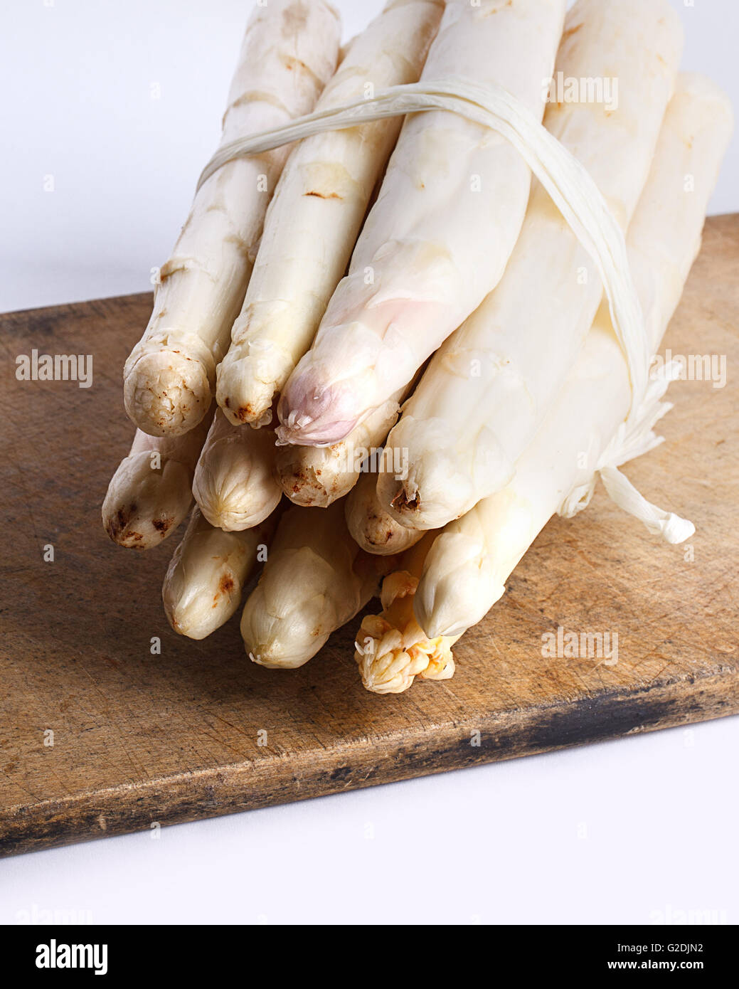 Bunch of fresh white asparagus spears ready to be used as an ingredient in cooking Stock Photo