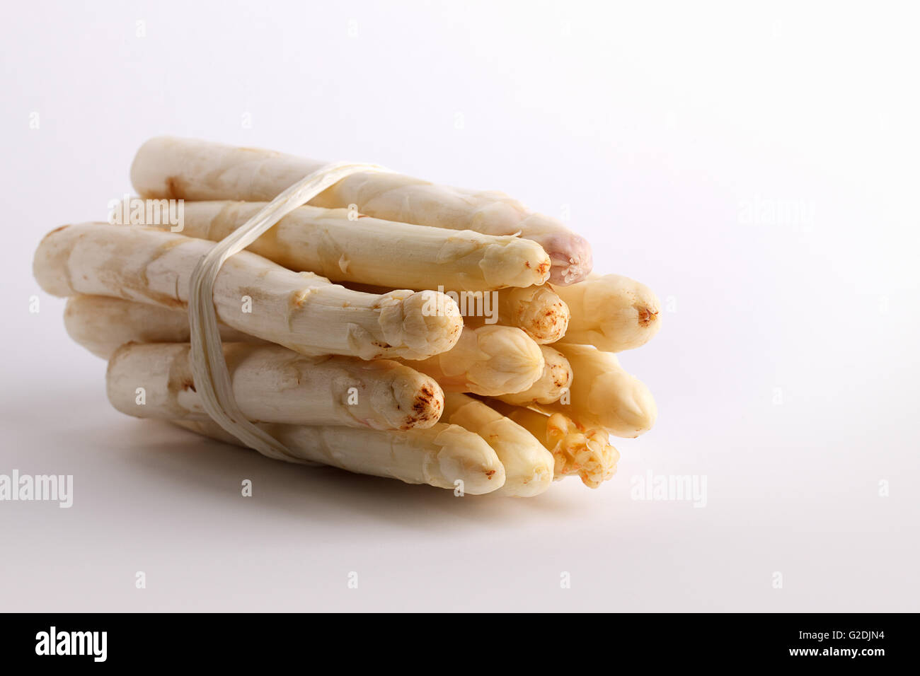 Bunch of fresh white asparagus spears ready to be used as an ingredient in cooking Stock Photo