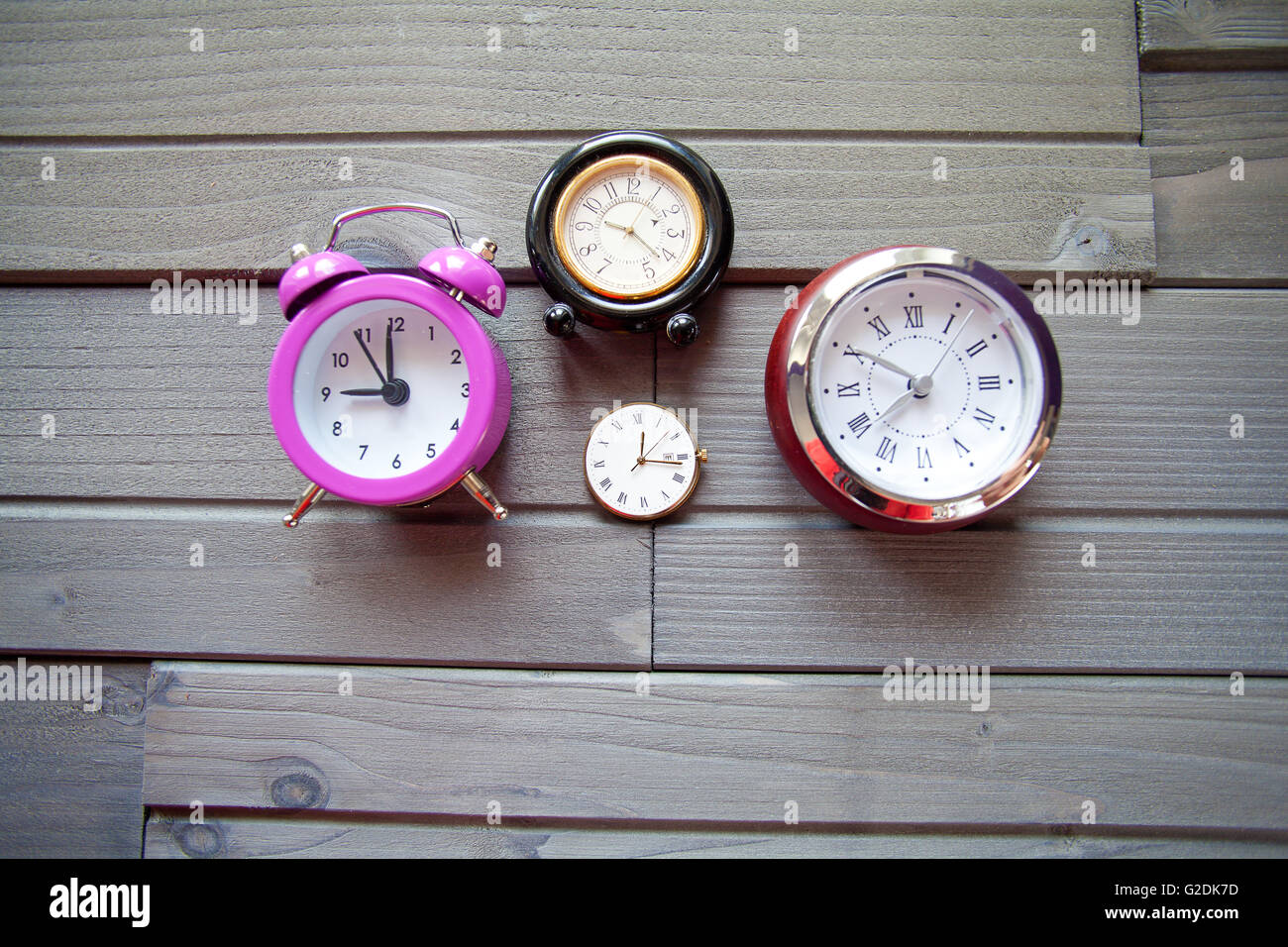 Group of Clocks on wood Stock Photo Alamy