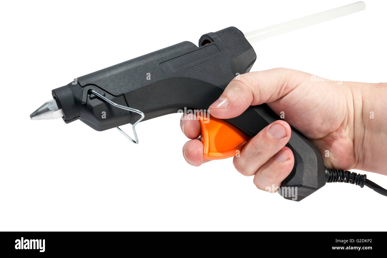 Woman glues pasta with a hot glue gun during the manufacture of crafts  Stock Photo - Alamy