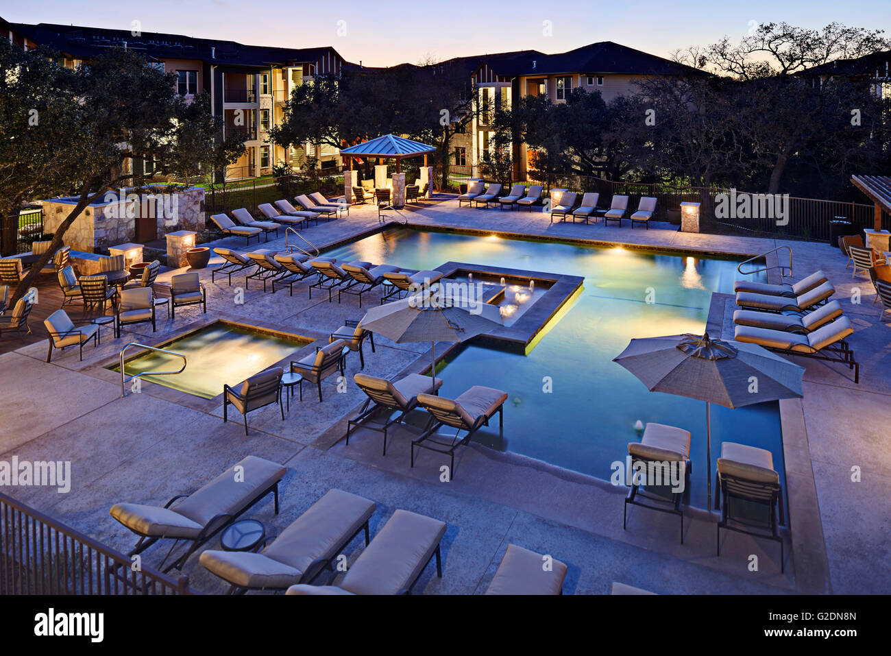 Apartment Complex Swimming Pool at Dusk Stock Photo