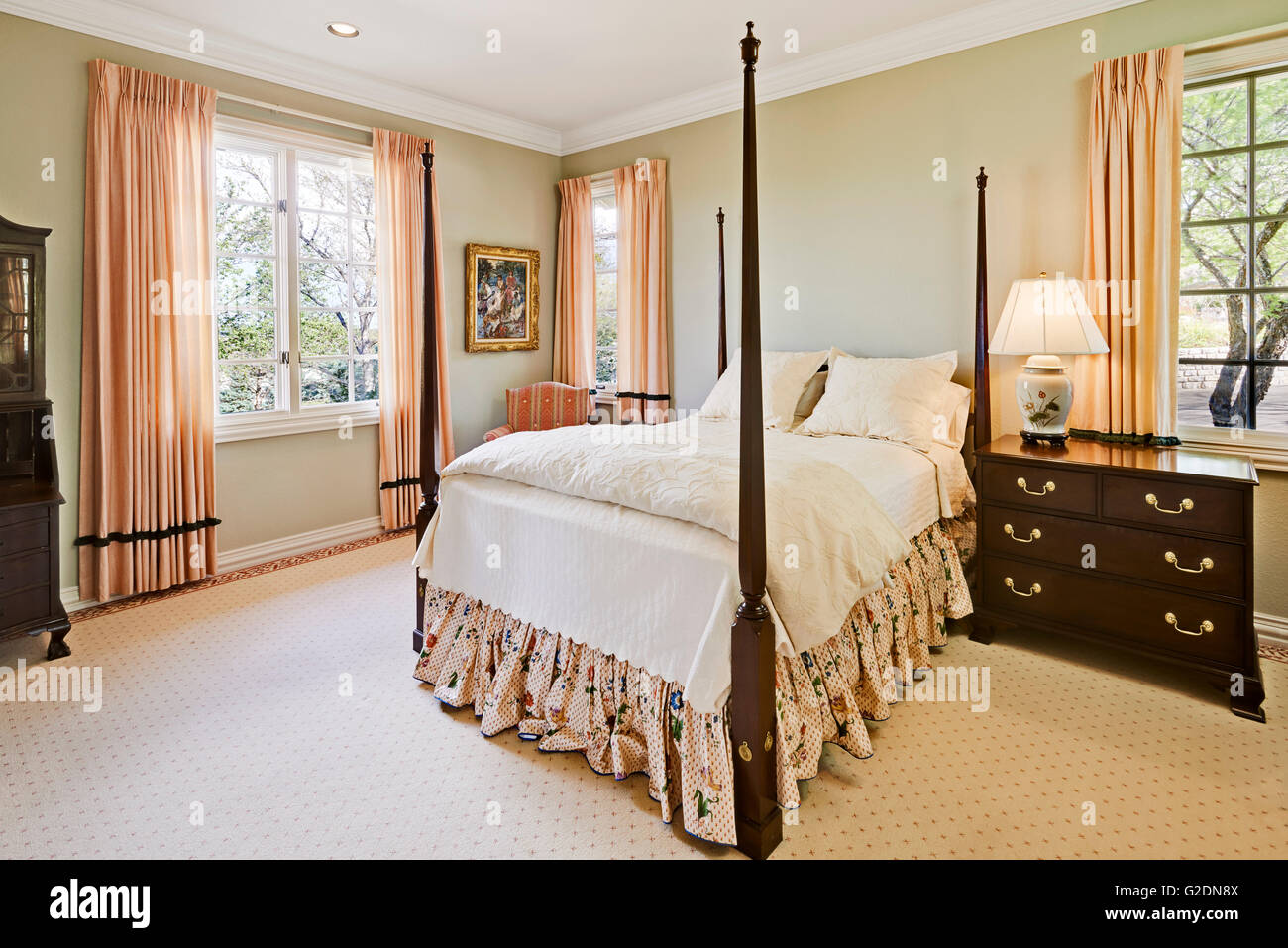 Residential Bedroom with Traditional Furniture and 4-Poster Bed Stock ...