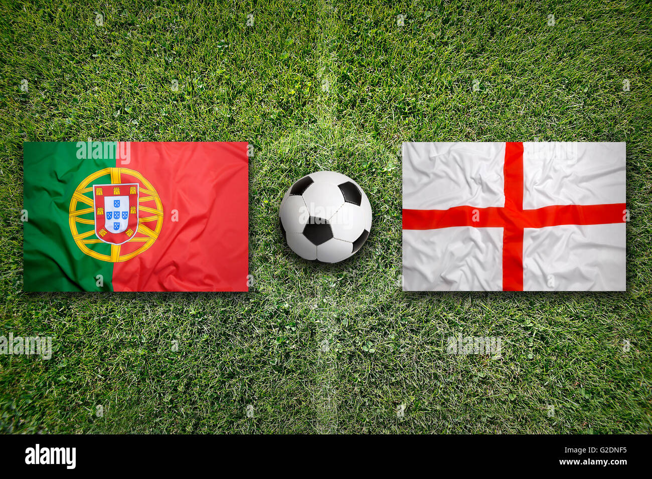Portugal vs. England flags on a green soccer field Stock Photo Alamy