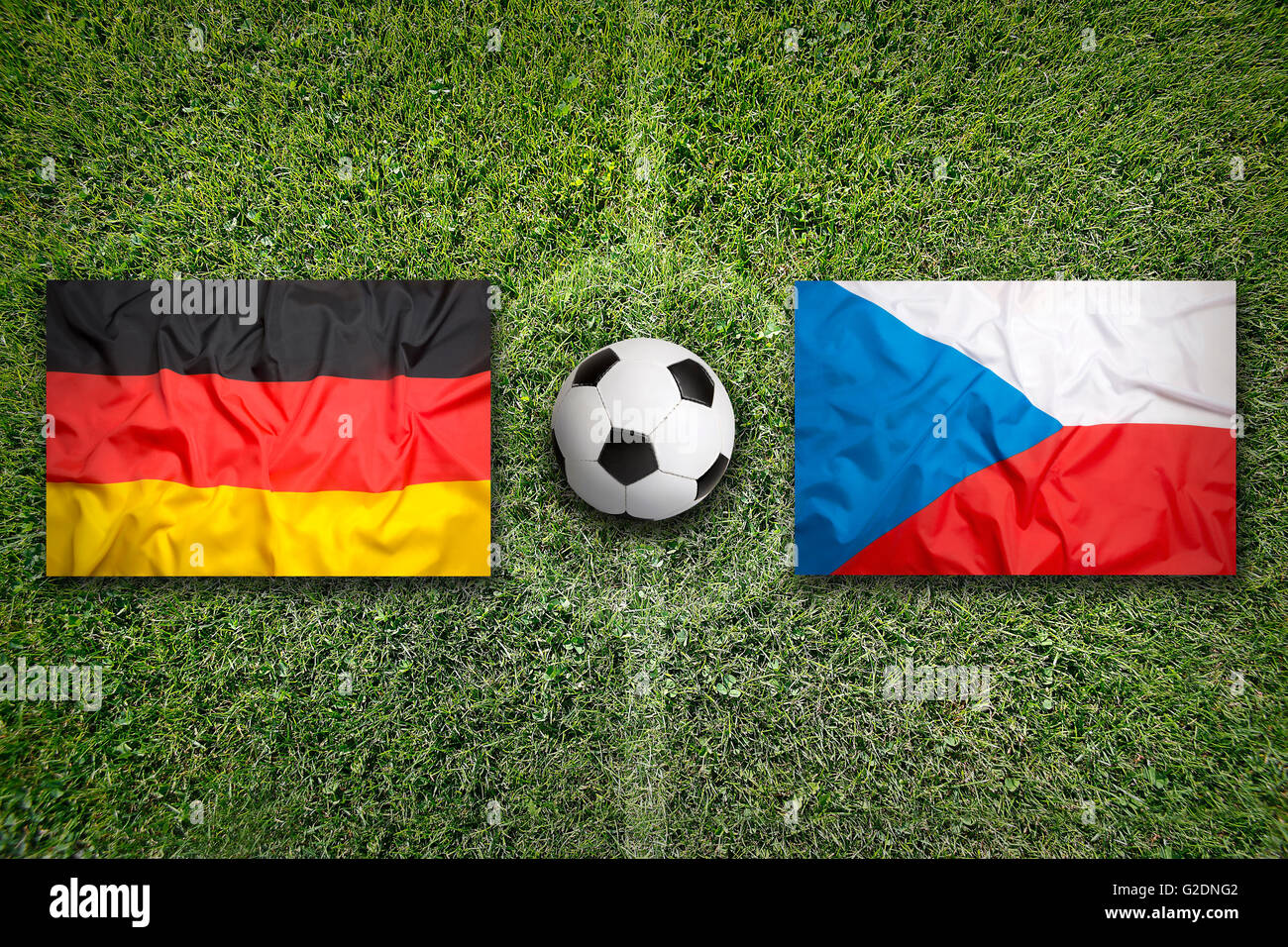 Germany vs. Czech Republic flags on a green soccer field Stock Photo