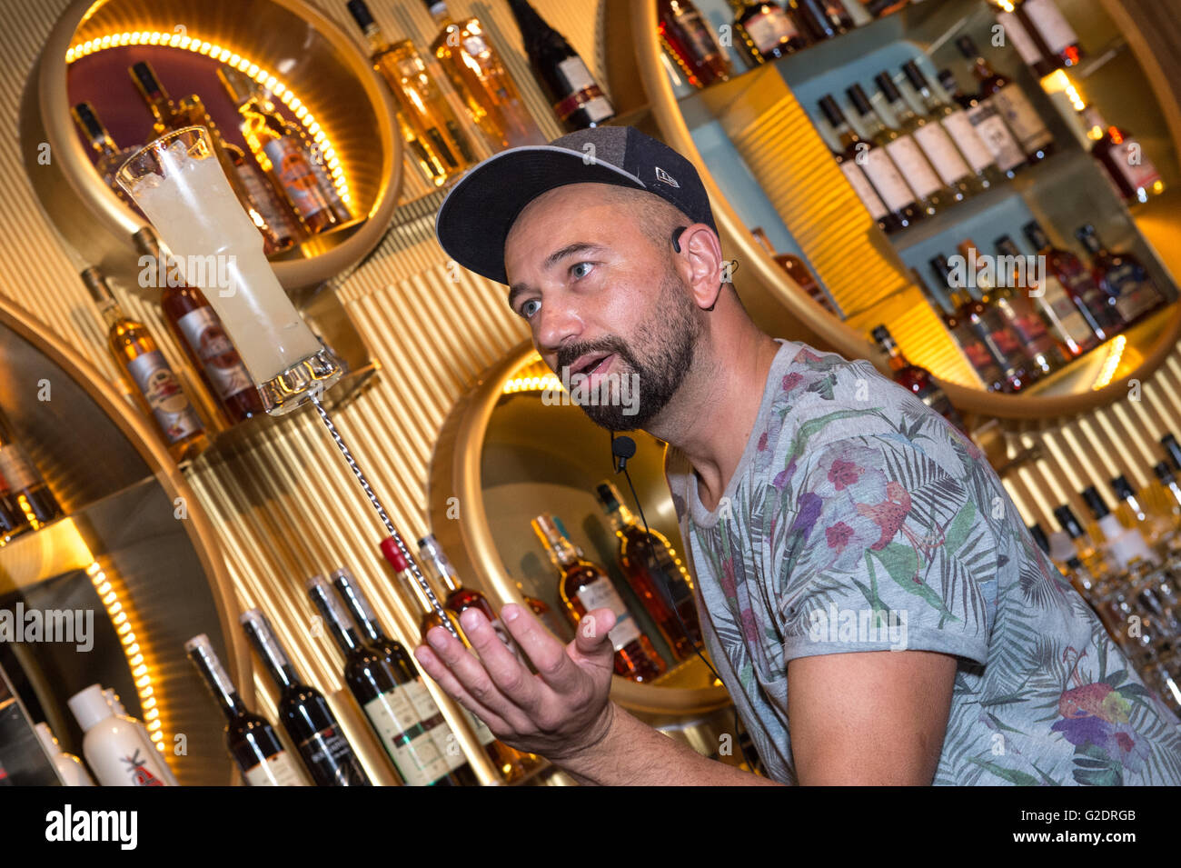 Nicolas Saint-Jean the worlds renowned 'Flair' bartender puts on a show of  his signature move- supporting a cocktail on a bar sp Stock Photo - Alamy