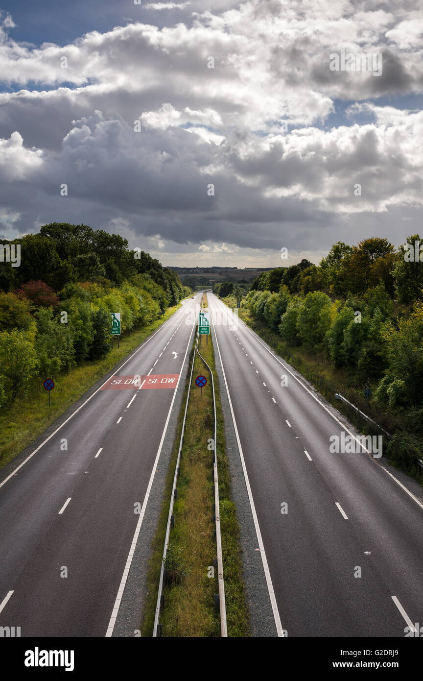 A dual carriageway (North American English: divided highway) is a class of highway with dual carriageways for traffic traveling Stock Photo