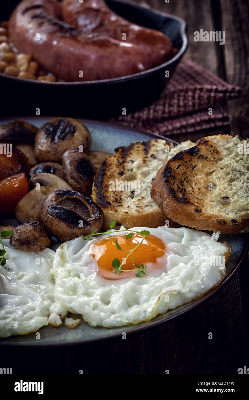 English breakfast with eggs, tomatoes, mushrooms, bacon, beans Stock