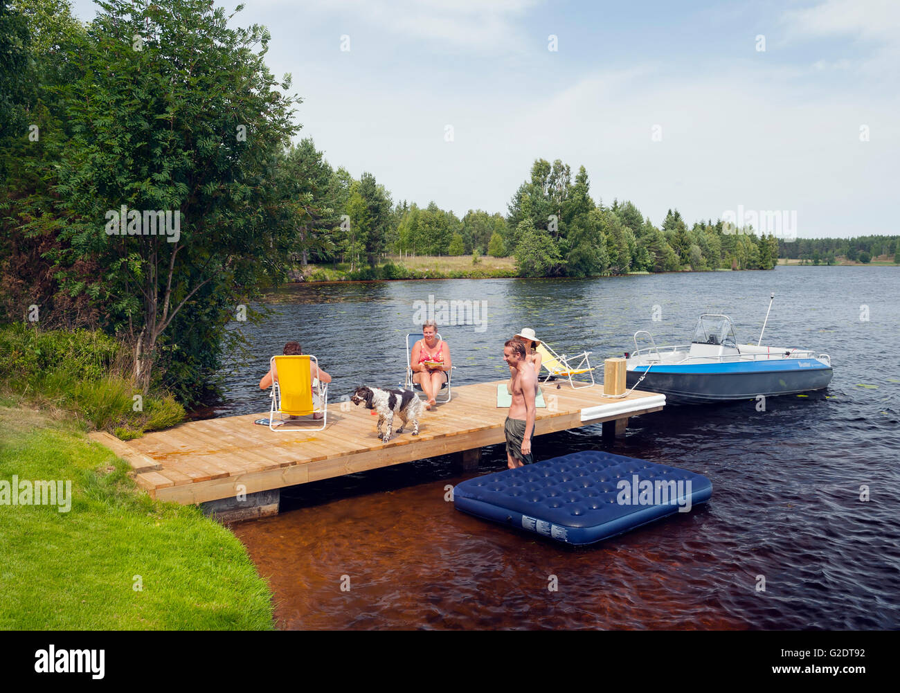 Summer life on the jetty Stock Photo - Alamy