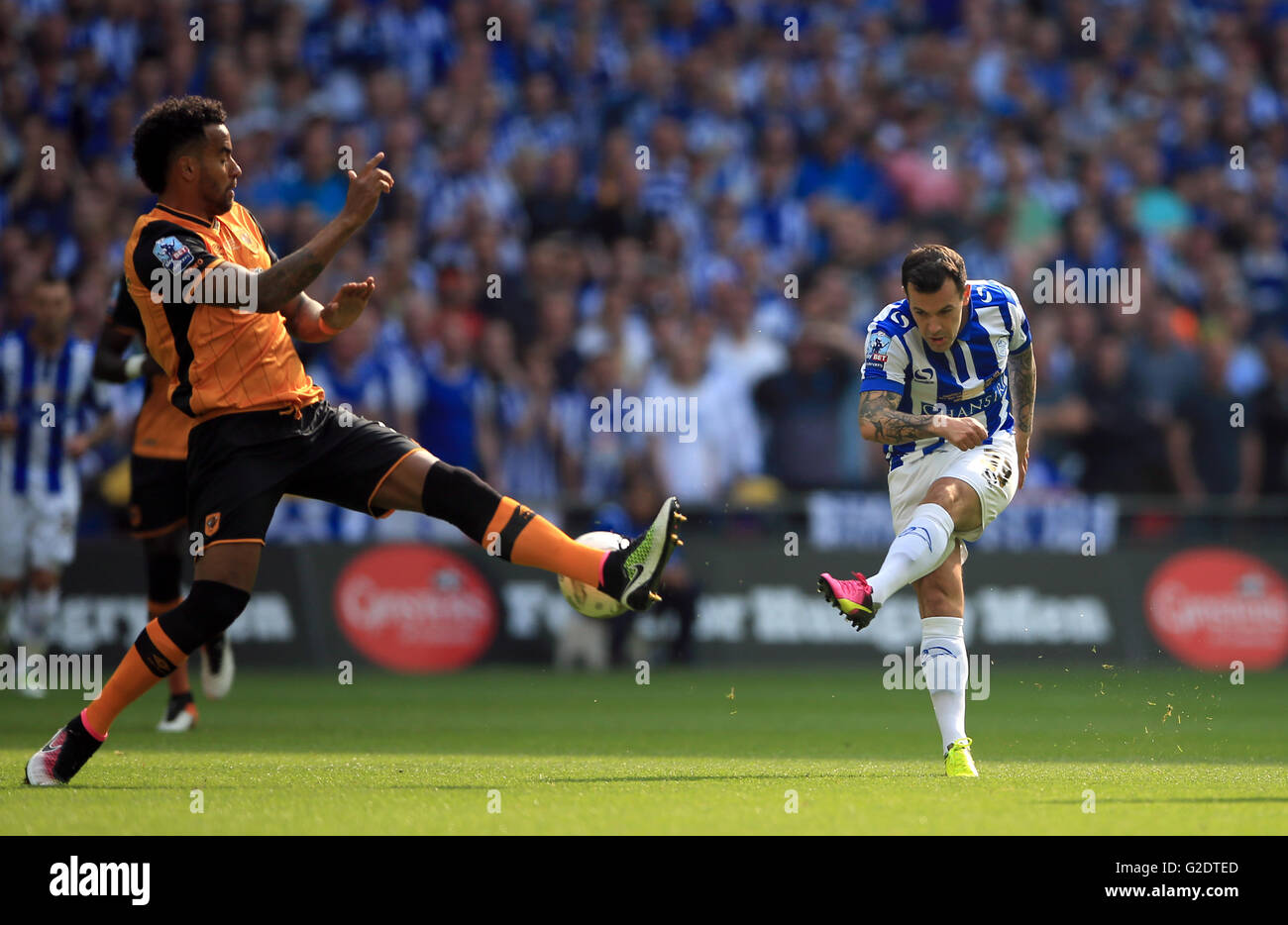 Sheffield Wednesday's Ross Wallace has a shot blocked by Hull City's Tom Huddlestone during the Championship Play-Off Final at Wembley Stadium, London. Stock Photo