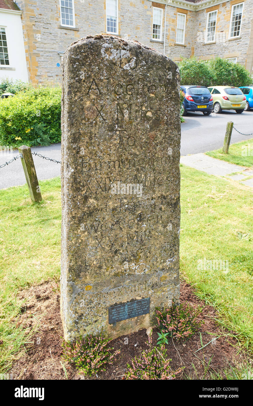 Stone Milestone Marker Dating From 1730 And Used Roman Numerals To Show Distance Vine Street Evesham Wychavon Worcestershire UK Stock Photo
