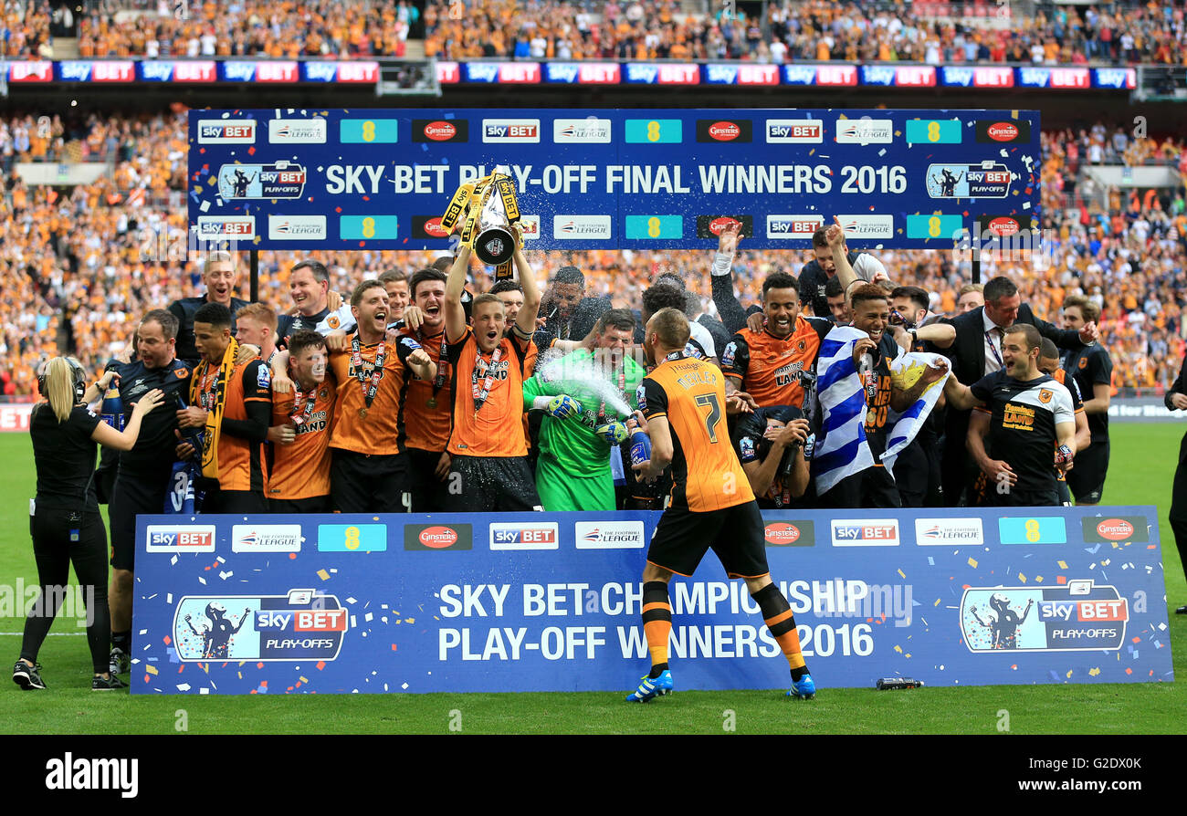 Hull City's Michael Dawson lifts the trophy after winning the Championship Play-Off Final at Wembley Stadium, London. PRESS ASSOCIATION Photo. Picture date: Saturday May 28, 2016. See PA story SOCCER Championship. Photo credit should read: Nigel French/PA Wire. RESTRICTIONS: No use with unauthorised audio, video, data, fixture lists, club/league logos or 'live' services. Online in-match use limited to 75 images, no video emulation. No use in betting, games or single club/league/player publications. Stock Photo