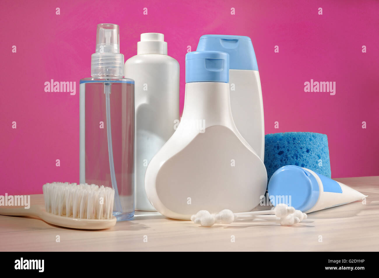 toiletries baby detail, blue items and pink background Stock Photo