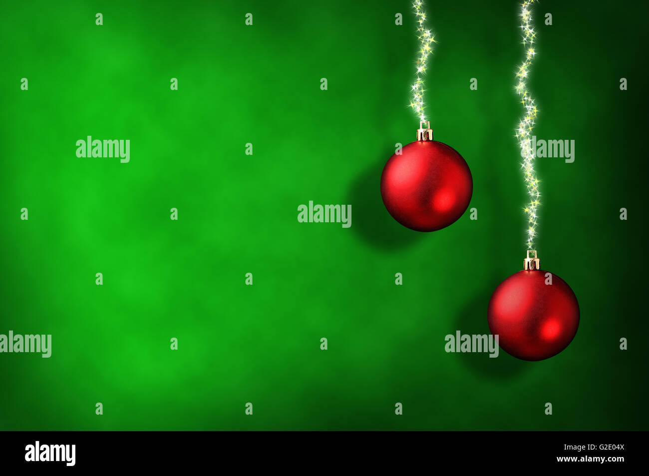 Christmas green background with two red balls and ribbon stars ...