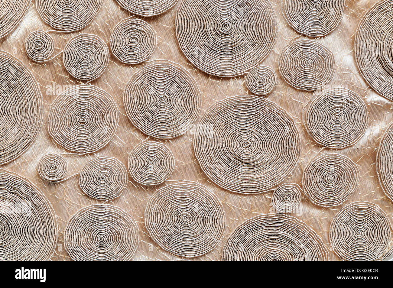 Rope circles background on brown cloth Stock Photo