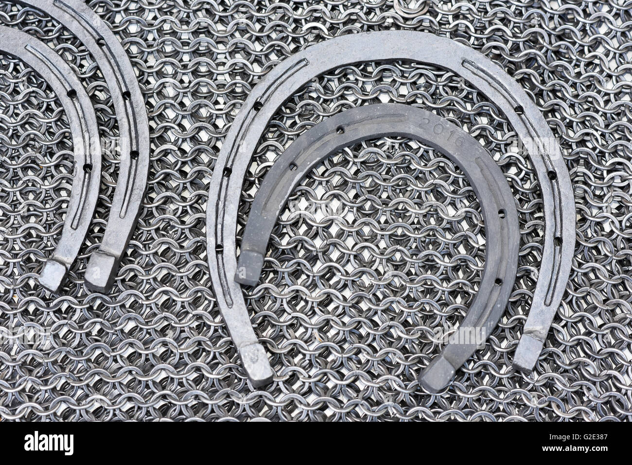 Metal products blacksmith - Military chainmail and horseshoe Stock Photo