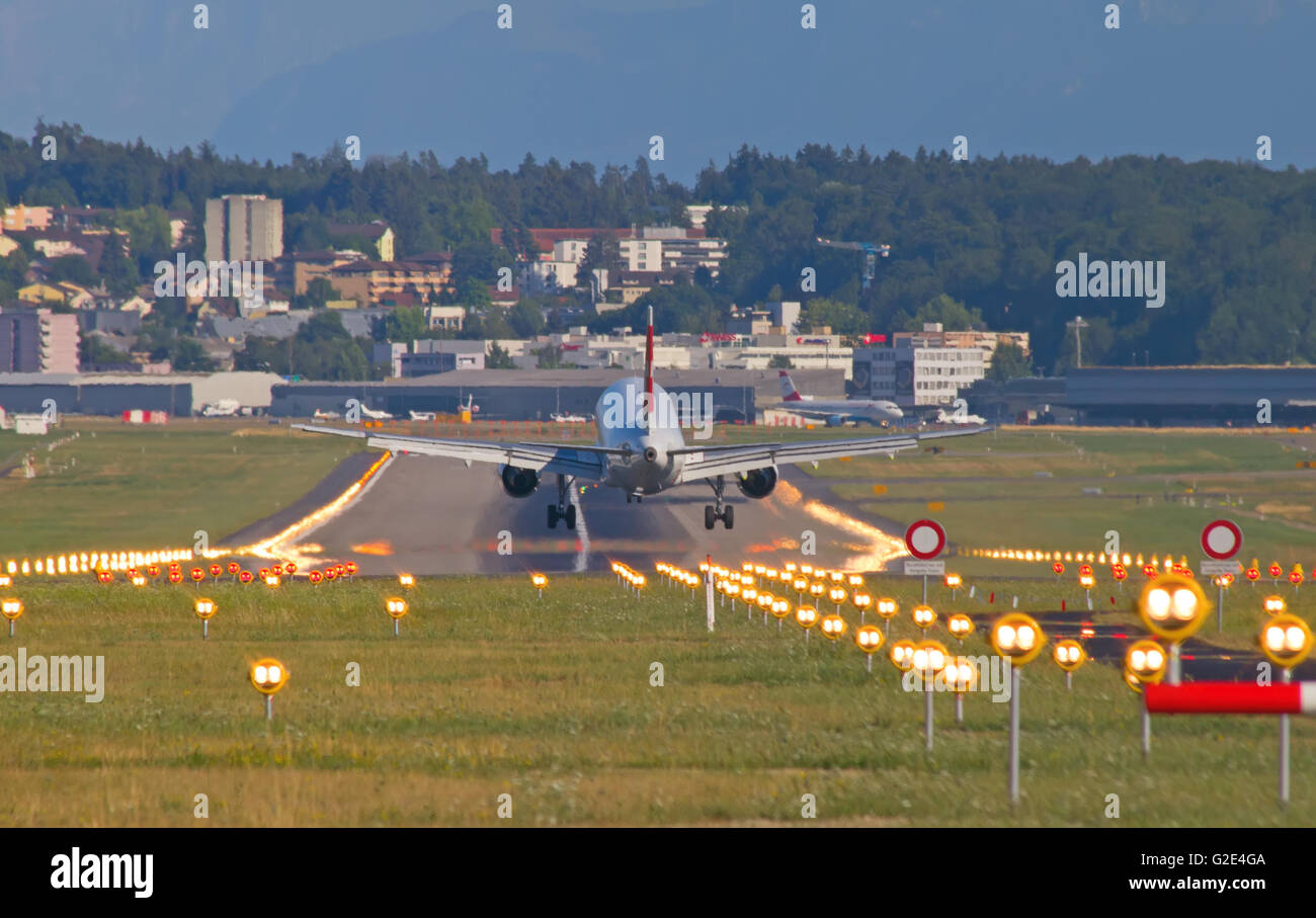 ZURICH - JULY 18: Swiss A-320 landing in Zurich airport after short haul flight on July 18, 2015 in Zurich, Switzerland. Zurich  Stock Photo