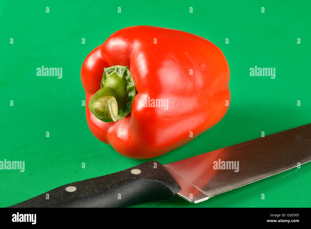 Red bell pepper on green chopping board - the correct colour board for ...