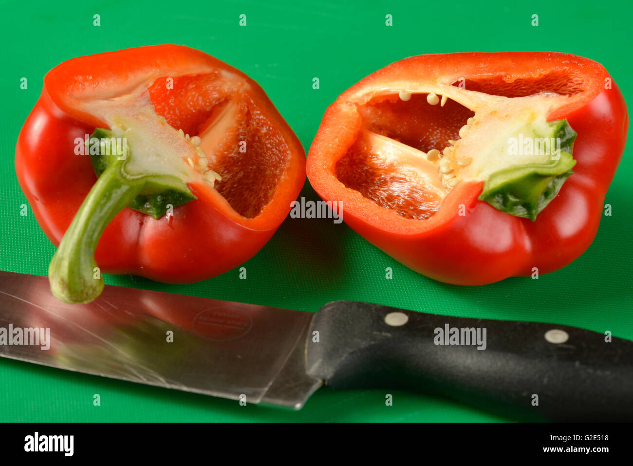 Red bell pepper on green chopping board - the correct colour board for ...