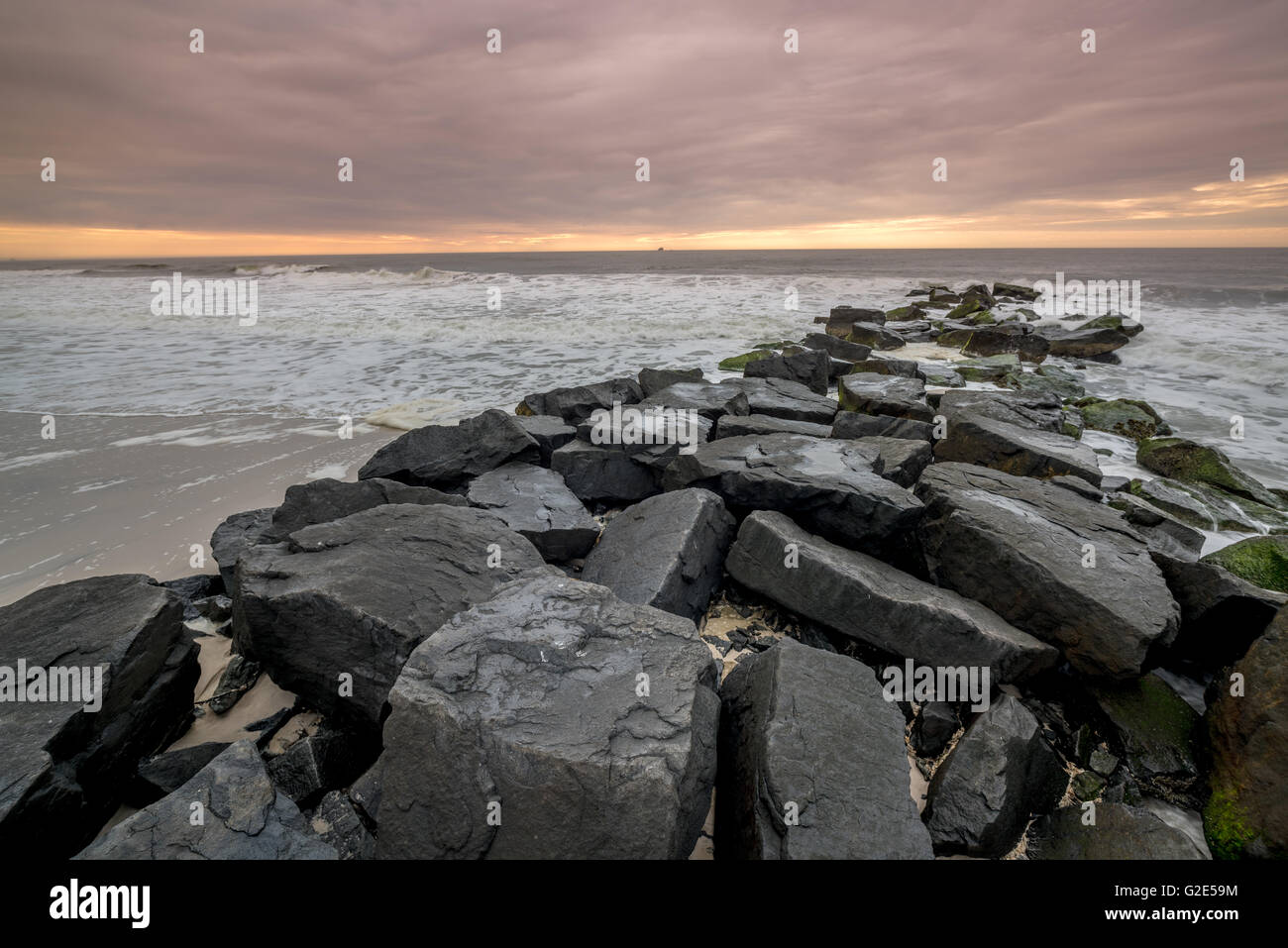 Jetty made of rocks and ocean wavers crashing from Atlantic Ocean Stock Photo Alamy