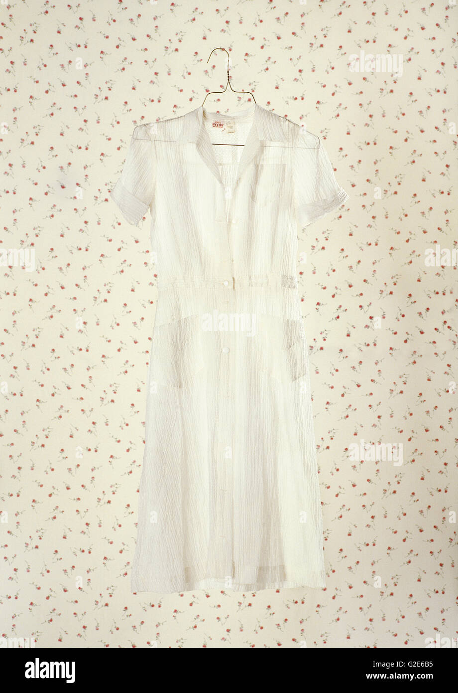 White Dress on Wallpaper Stock Photo - Alamy