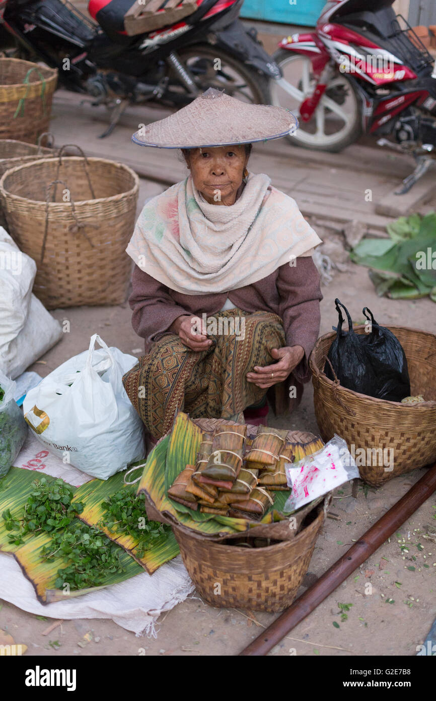 Woman selling vegetables, fruits and other food, in a market, Myanmar, Burma, Southeast Asia, Asia Stock Photo