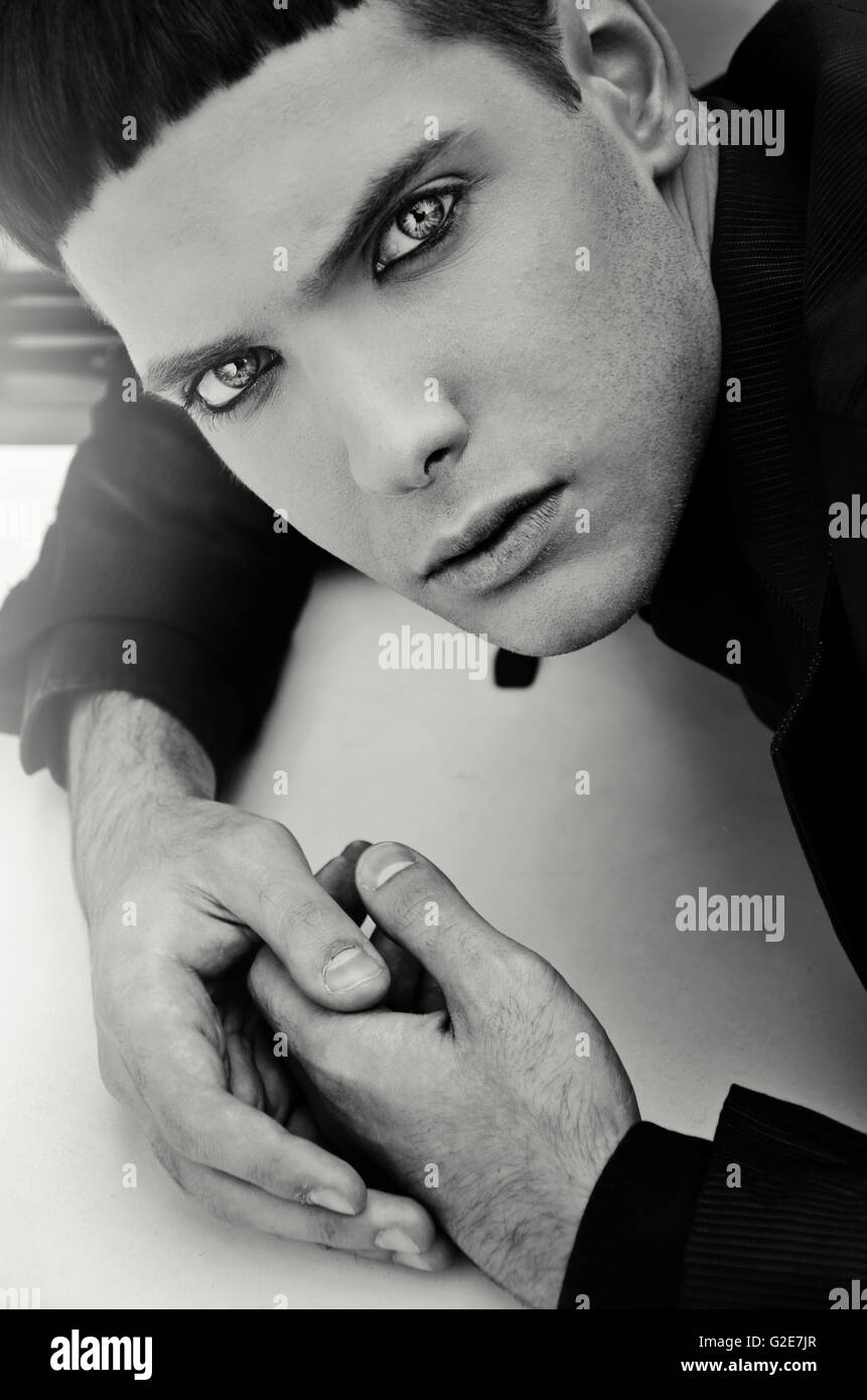 Young serious brunette man hi-res stock photography and images - Alamy