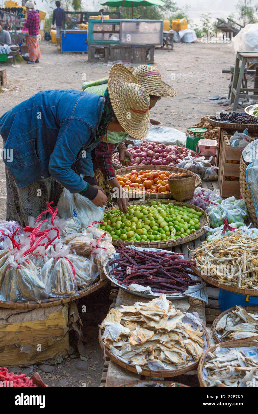 Woman selling vegetables, fruits and other food, in a market, Myanmar, Burma, Southeast Asia, Asia Stock Photo