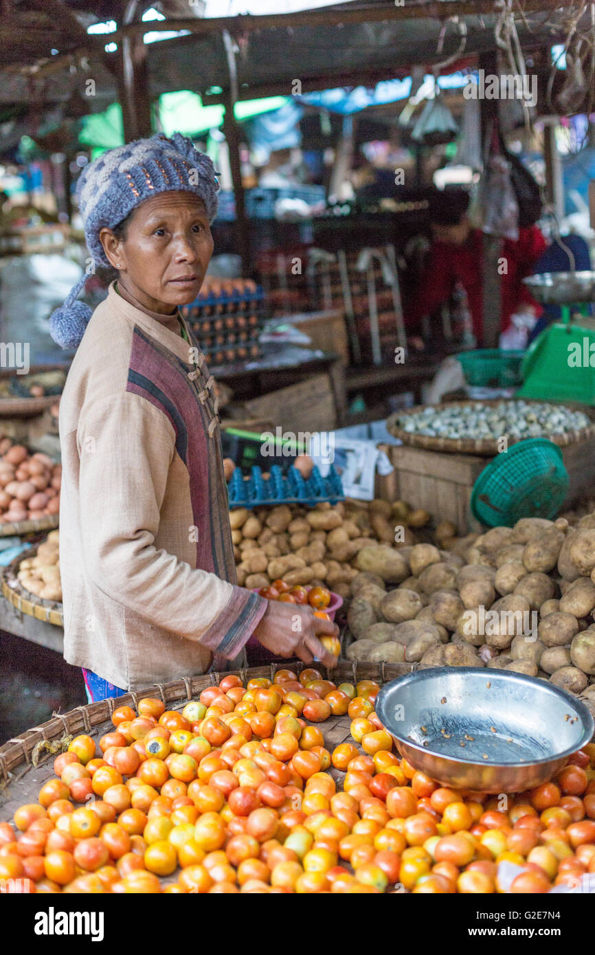 Woman selling vegetables, fruits and other food, in a market, Myanmar, Burma, Southeast Asia, Asia Stock Photo