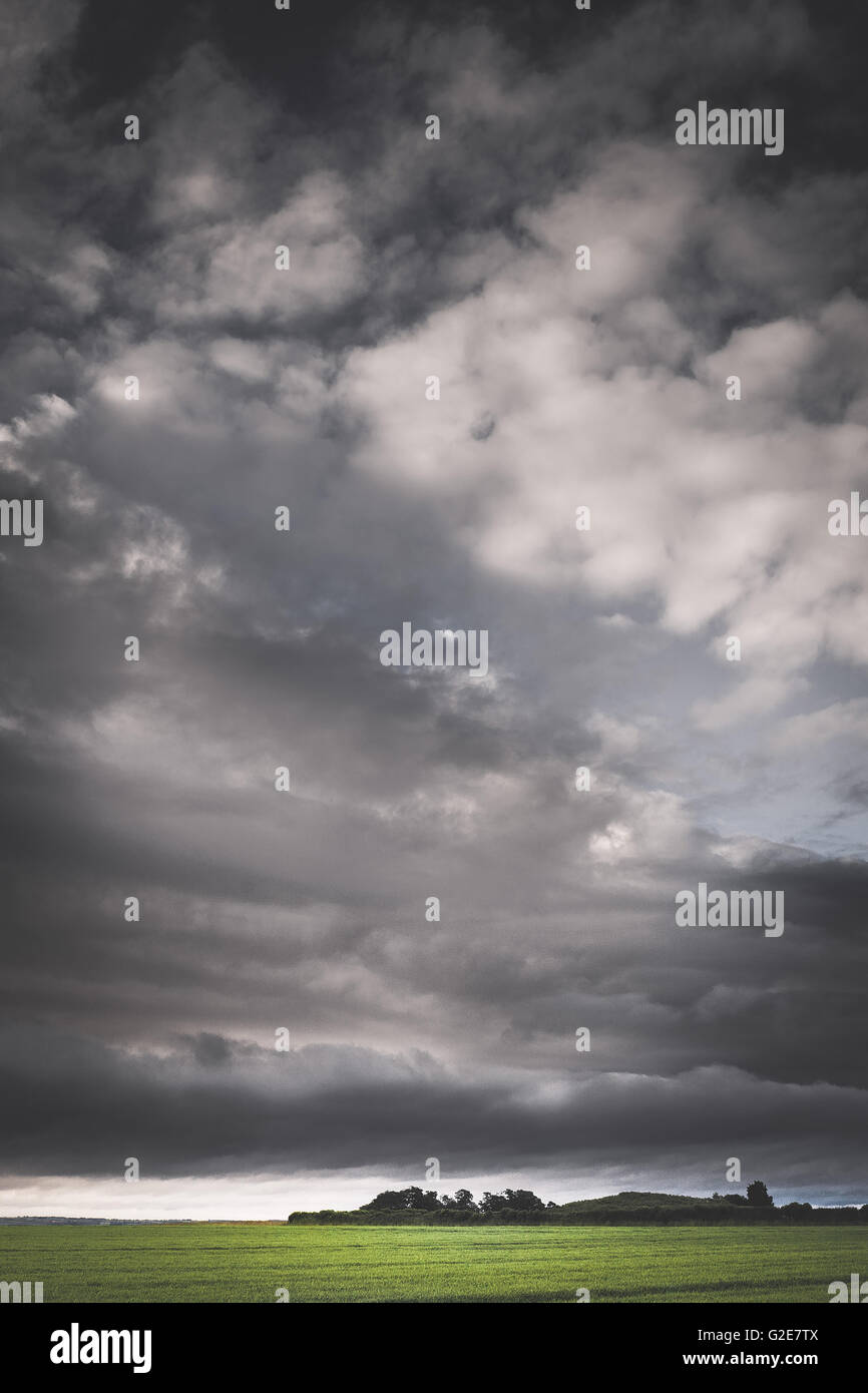 Green Field with Storm Clouds Stock Photo - Alamy