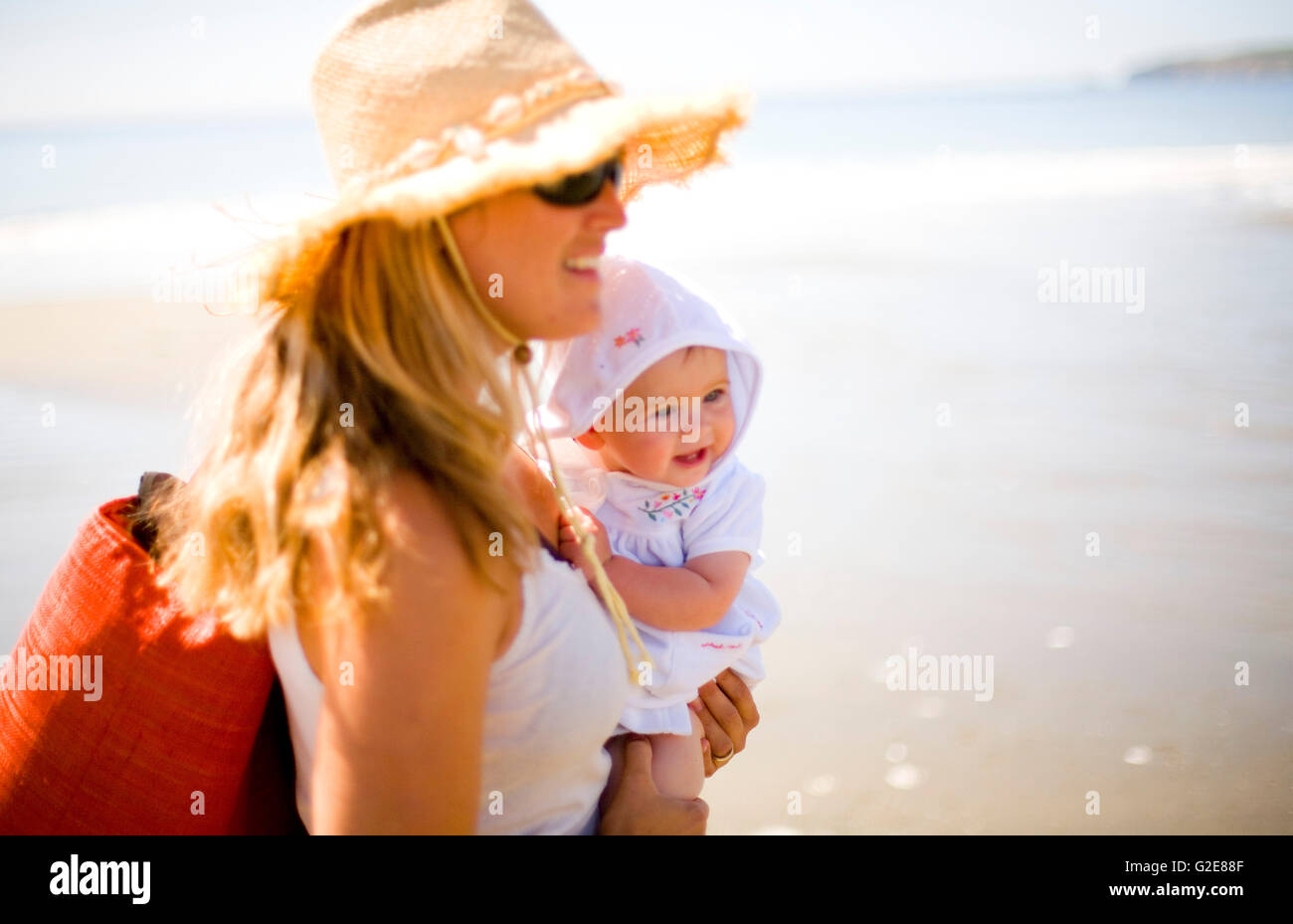 Mother and Baby on Sunny Beach Stock Photo