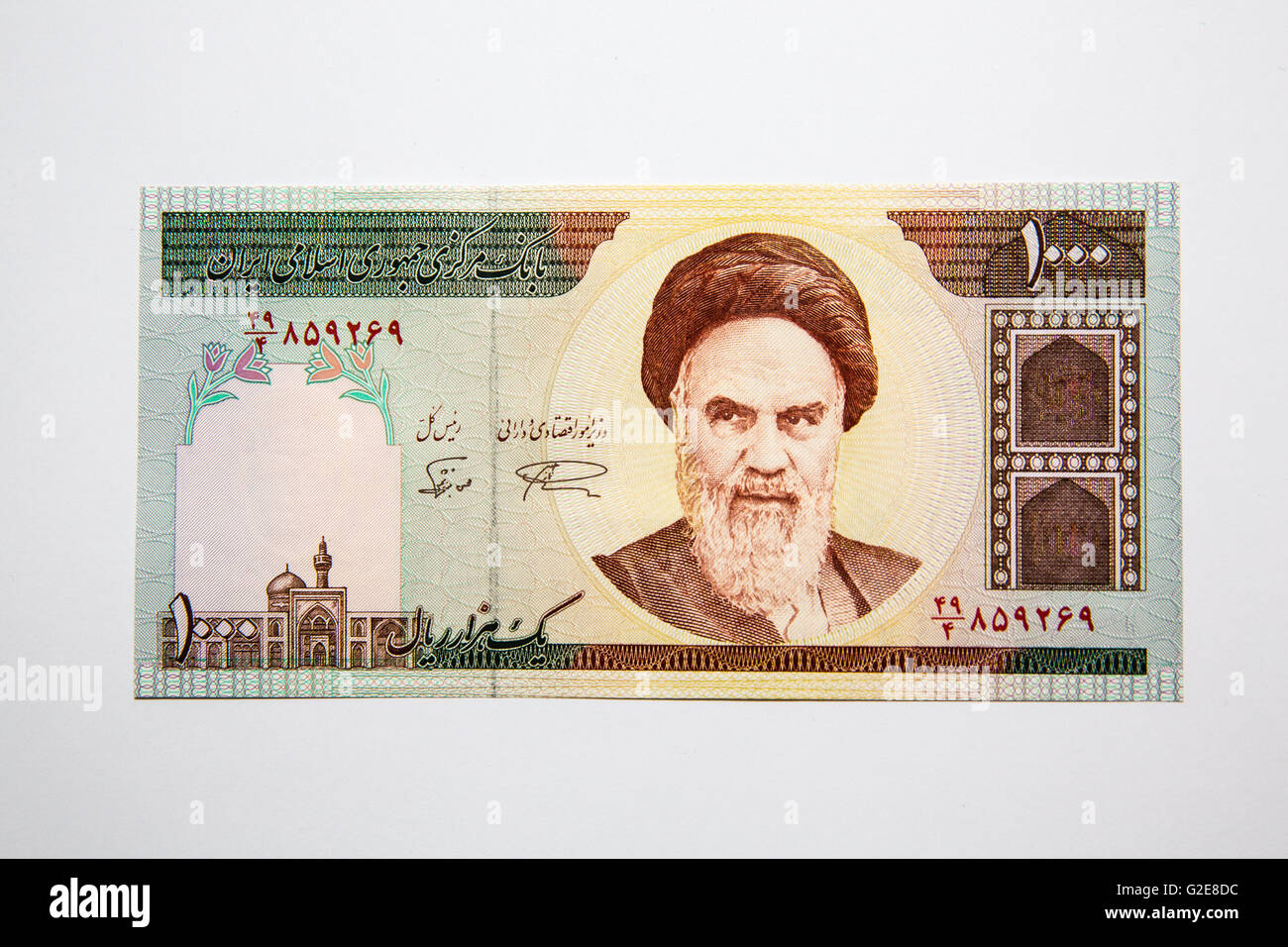 The front side of an Iranian 1000 Rial paper note lying on a table Stock Photo