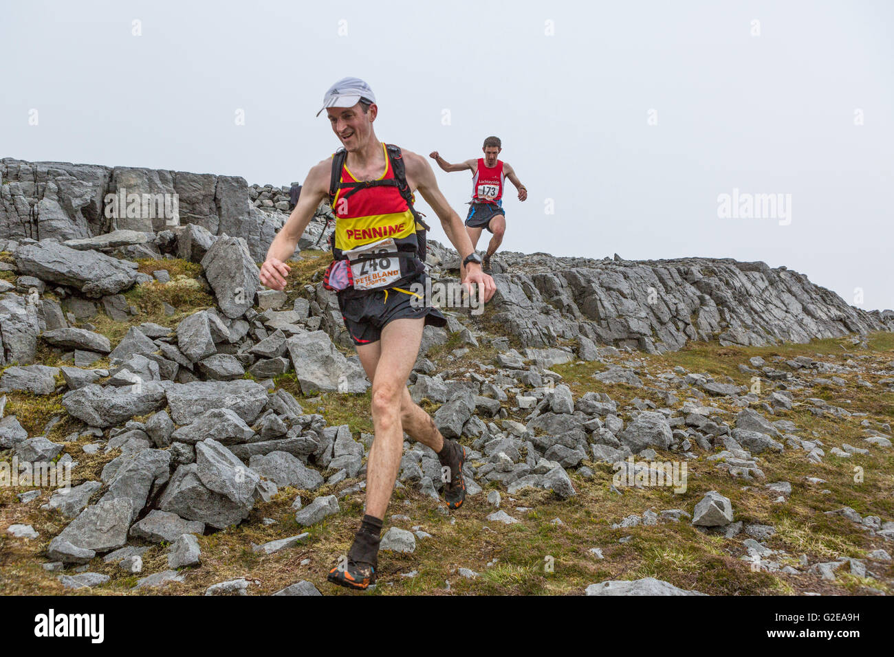 Jura, UK. 28th May, 2016. The Jura Fell Race is one of the toughest British Hill Race challenges with a 28km course taking in 7 mountain summits and a total rise of 2370m. Taking place on the Scottish island of Jura and sponsored by the Isle of Jura Distillery, over 250 runners took part in the event with the winner Finlay Wild completing the course in 3 hours 9 minutes and 53 seconds. The Women’s race was won by Jasmin Paris in 3 hours 40 minutes and 59 seconds.  Pictured: Runners entering the first checkpoint at Dubh Beinn Credit:  Richard Dyson/Alamy Live News Stock Photo