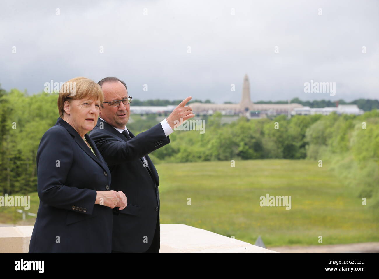 French President Francois Hollande and German Chancellor Angela Merkel (CDU) standing on the terrace of the museum in Douaumont near Verdun, France, 29 May 2016. 100 years ago, the Battle of Verdun between German and French troops began, lasting for roughly 300 days and causing more than 300,000 victims on both sides. The town in North-Eastern France became the epitome for the brutal emplacement battles of World War I. PHOTO: KAY NIETFELD/dpa Stock Photo